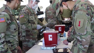 U.S. Army Soldiers administer COVID-19 vaccine 1