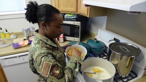 Cooking African American cultural foods with Senior Airman Stewart