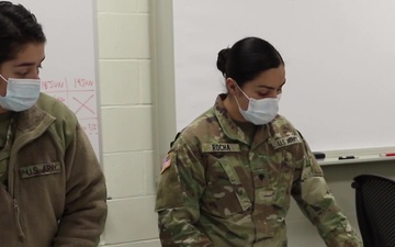 Nebraska National Guard Soldiers and Airmen administer and receive a COVID-19 vaccine