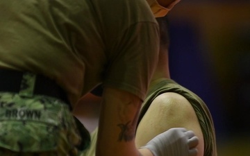 U.S. Marine Corps and Navy personnel receive Moderna COVID-19 Vaccine (B-Roll)