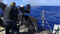 USS John S. McCain conducts live-fire exercise