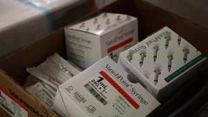 Air Force medical personnel prepare vaccines at NRG CVC