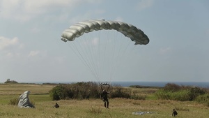 Riggers and Recon Marines jump over Ie Shima - BROLL