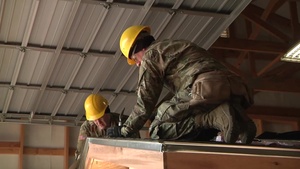 102d Training Division instructors help students hone carpentry and masonry skills in 12 W course