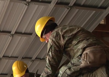 102d Training Division instructors help students hone carpentry and masonry skills in 12 W course