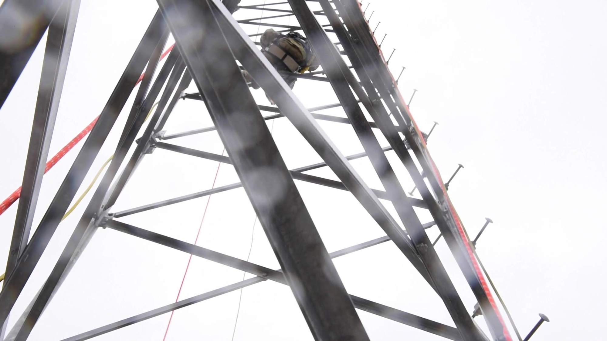 Airmen from the 102nd Intelligence Wing’s 212th Engineering Installation Squadron train and recertify on tower rescue procedures at Otis Air National Guard Base, Massachusetts, April 11, 2021. These Cable and Antenna Systems Airmen are preparing for an upcoming mission where they will build a 113 foot tower from the ground up.