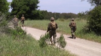 Defense in depth: IMC Marines patrol defensive positions during Week 12