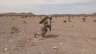 Marines clear obstacles with explosives (B-Roll)