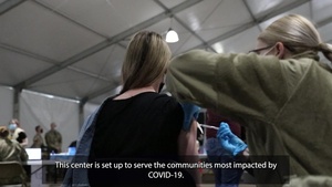 A U.S. Service Member speaks to the local Spanish Speaking Community St. Paul, Minnesota Community Vaccination Center