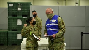 Reserve Citizen Airmen process through a deployment line as part of Nexus Dawn