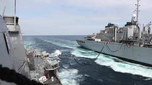 USS Ross conducts a replenishment-at-sea with USNS Supply