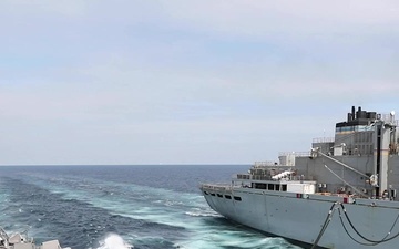 USS Ross conducts a replenishment-at-sea with USNS Supply