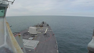 USS Ross fires its 5-inch gun during FOST