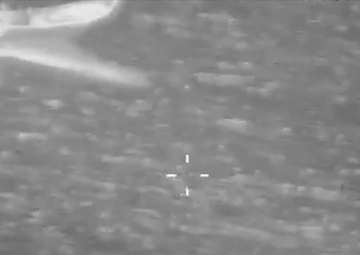 P-3 crew observes go-fast vessel crew jettison bales of contraband into ocean.