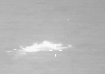 An AMO P-3 crew observes a semi-submersible (SPSS) smuggling vessel in the Caribbean.