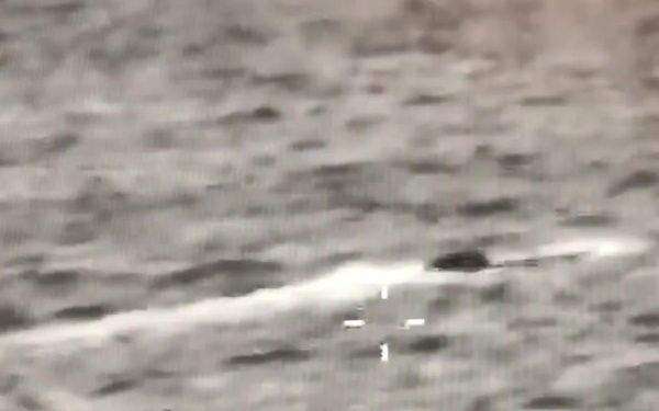 An AMO P-3 crew tracks a low profile smuggling vessel