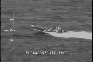 An AMO P-3 crew tracks a “go-fast” smuggling vessel.