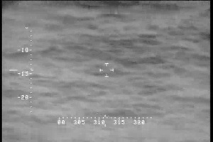 An AMO P-3 observes a “go-fast” smuggling vessel.
