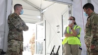 U.S. Air Force Airmen join forces with AmeriCorps volunteers to help observe vaccinated community members