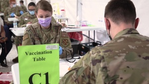 Maj. Godwin vaccinates her cousin at the Greenbelt Metro CVC