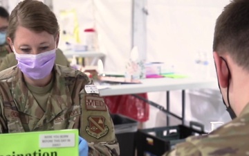 Maj. Godwin vaccinates her cousin at the Greenbelt Metro CVC