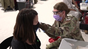 Maj. Leah Godwin speaks about vaccinating her cousin at the Greenbelt Metro CVC