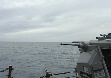 Mark 38 machine gun fires aboard USS Ross