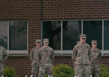 Airman Leadership School students conduct reveille on Flag Day