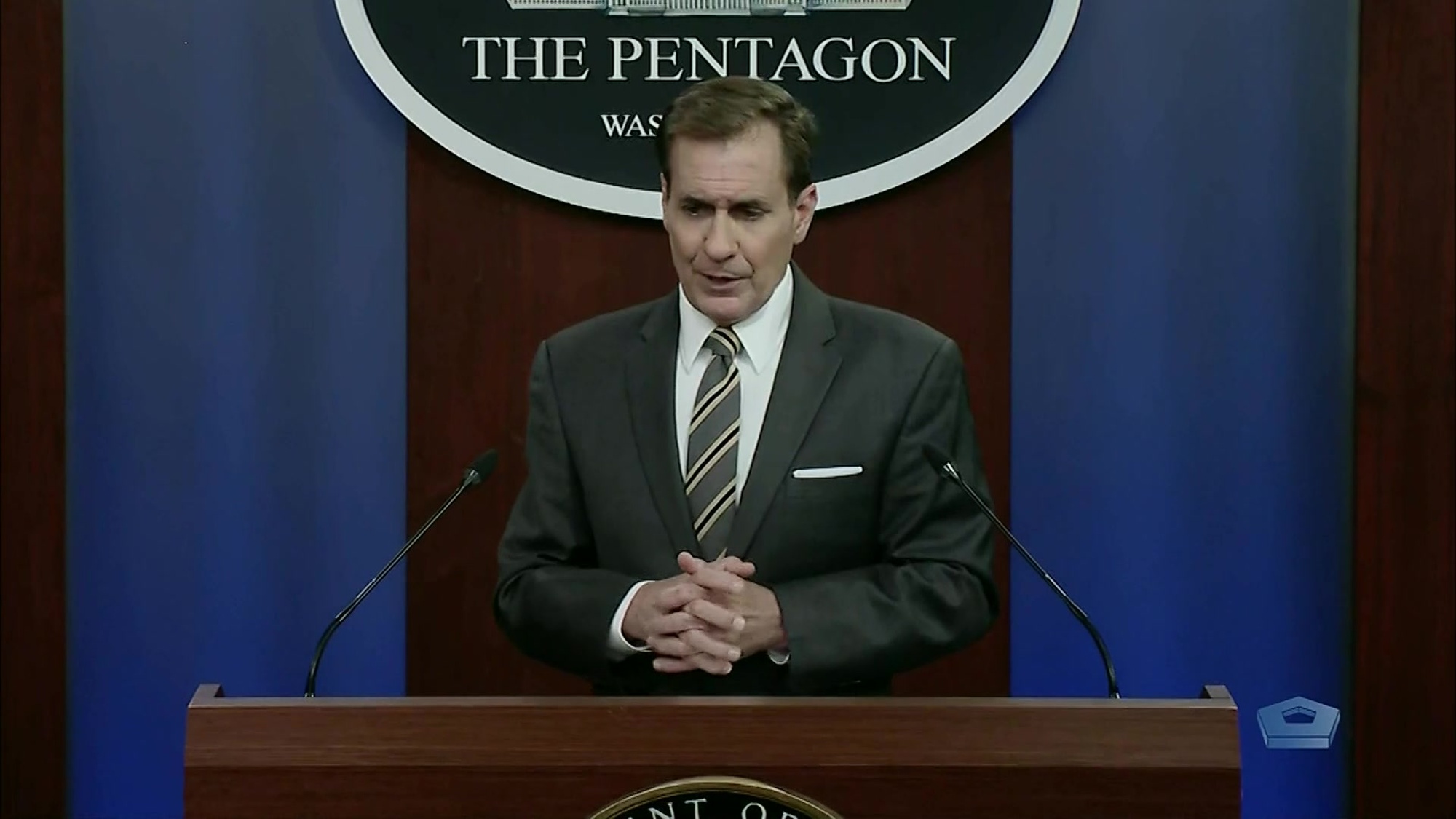 Pentagon press secretary speaks at a lectern.