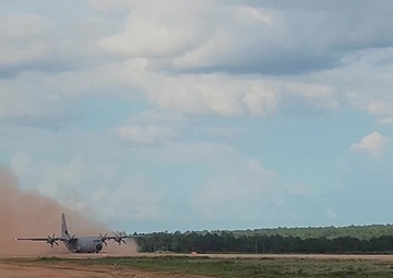 815th AS kicking up dust; letting cargo, personnel drop