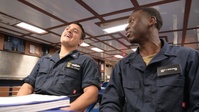 Sailors watching AFN