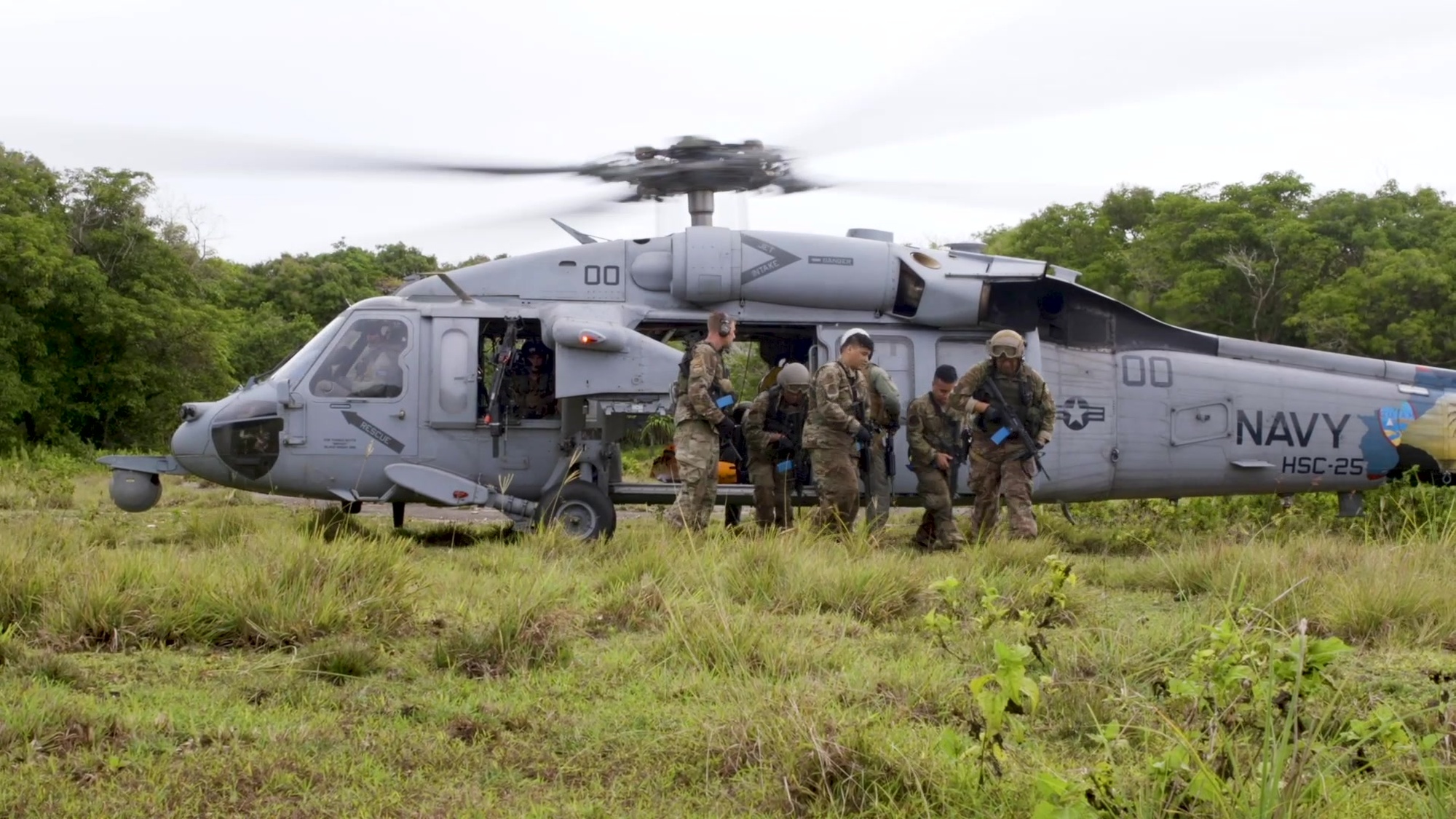 Airmen assigned to the 154th Fighter Wing with the Hawaii Air National Guard perform simulated emergency field medical procedures during a combat readiness training during Operation Pacific Iron 2021, July 2021, at Andersen Air Force Base, Guam. PACIRON 2021 is a U.S. Pacific Air Forces&#39; operation to project forces into the U.S. Indo-Pacific Command area of responsibility.