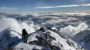 Mountaineers on Denali Walk Down Rocky Ledge