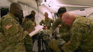 U.S. Army Reserve Medics treat simulated casualty during Regional Medic training at Fort McCoy, WI