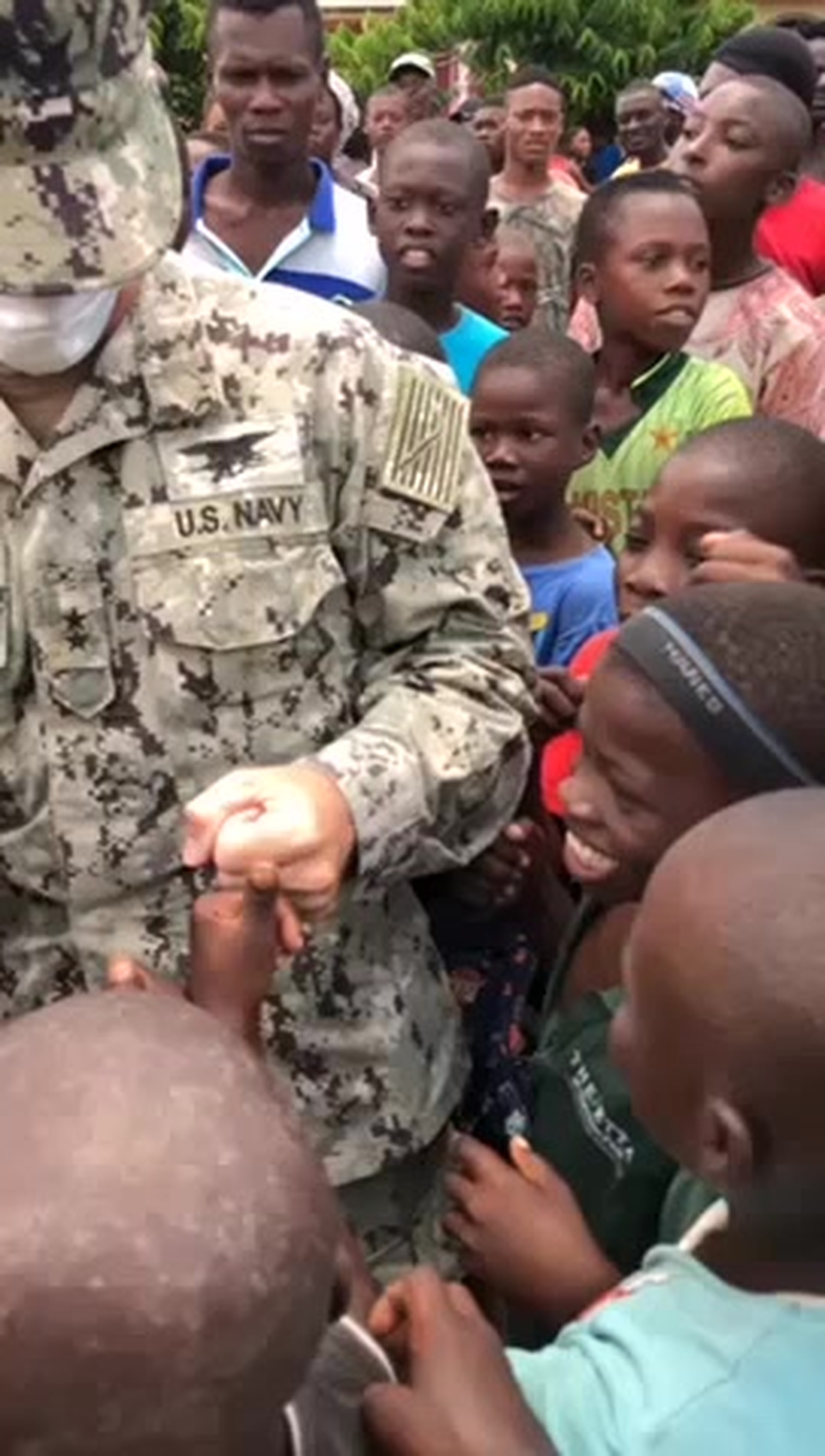 HAITI (Aug. 22, 2021) -- The commander of Joint Task Force-Haiti, Navy Rear Adm. Keith Davids, receives a warm welcome from Haitian children while regions most affected by the Aug. 14 earthquake. Joint Task Force-Haiti is conducting U.S. military operations, in support of USAID and alongside our international partners, to save lives and ease the suffering of victims. (Special Operations Command South video)