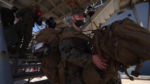B-Roll - US Marines and Sailors debark USS America