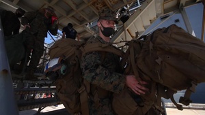 B-Roll - US Marines and Sailors debark USS America