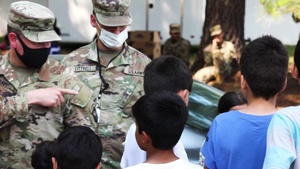 Operation Allies Welcome: U.S. Army Interpreter interacts with Afghan children