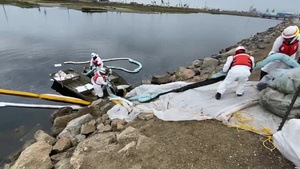 Orange County Oil Spill Response Workers Cleanup Oil
