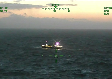 Coast Guard Air Station Kodiak C-130 drops oxygen bottles to Alaska Victory near Dutch Harbor