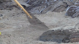 Contractors conduct cleanup operations on Crystal Cove Beach