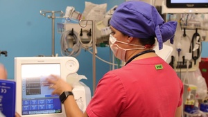 U.S. Navy perform ICU rounds and respiratory therapy training