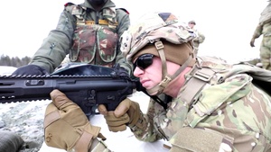 U.S. and Indian Army troops cross train weapons