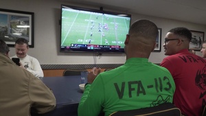 USS Carl Vinson (CVN 70) Sailors Watch Football
