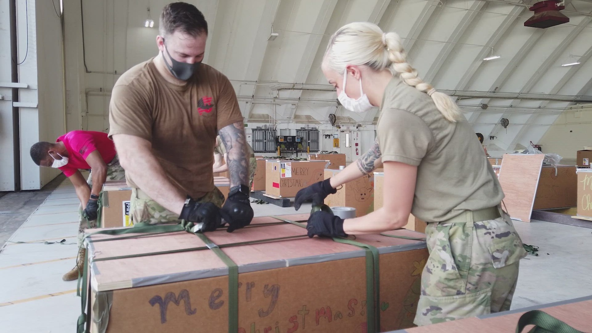 U.S. Air Force Airmen rig airdrop bundles packed with donated goods in support of the 70th annual Operation Christmas Drop at Andersen Air Force Base, Guam, Dec. 4, 2021. Over the course of 10 days, crews will airdrop donated food, supplies, educational materials, and tools to 55 islanders throughout the South-Eastern Pacific, including the Federated States of Micronesia, and the Republic of Palau. The international effort will allow Pacific Air Forces and partner nation Airmen to execute low-cost, low-altitude airdrop training, which will improve interoperability and communication for future real-world humanitarian assistance and disaster relief missions.