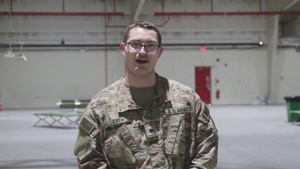 Spc. Ryan Gay, Newwark, Ohio, gives a "beat Navy" shoutout