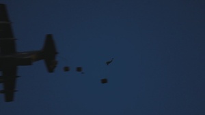 U.S. Marines recieve a supply drop from a U.S. Air Force MC-130J