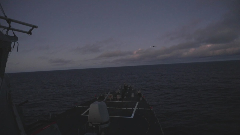 P8 Poseidon flies over USS Ross