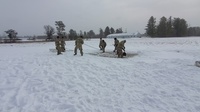 Cold-Weather Operations Course class 22-02 students learn about Arctic tent on snowy training day