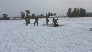 Cold-Weather Operations Course class 22-02 students learn about Arctic tent on snowy training day